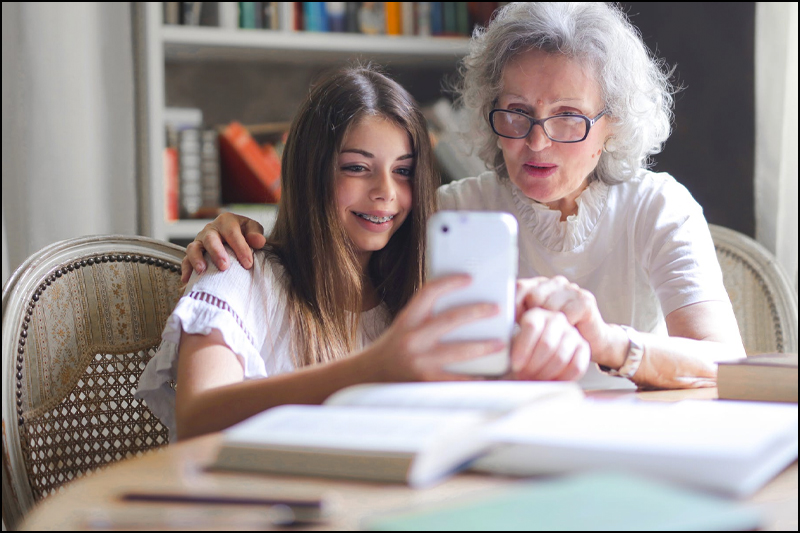 Grandma and granddaughter at table