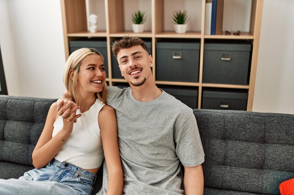 Man and woman sitting on the couch