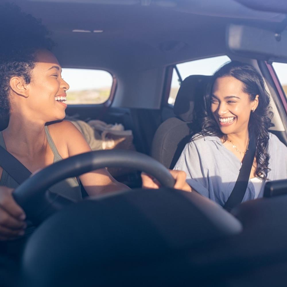 Two happy women in the car