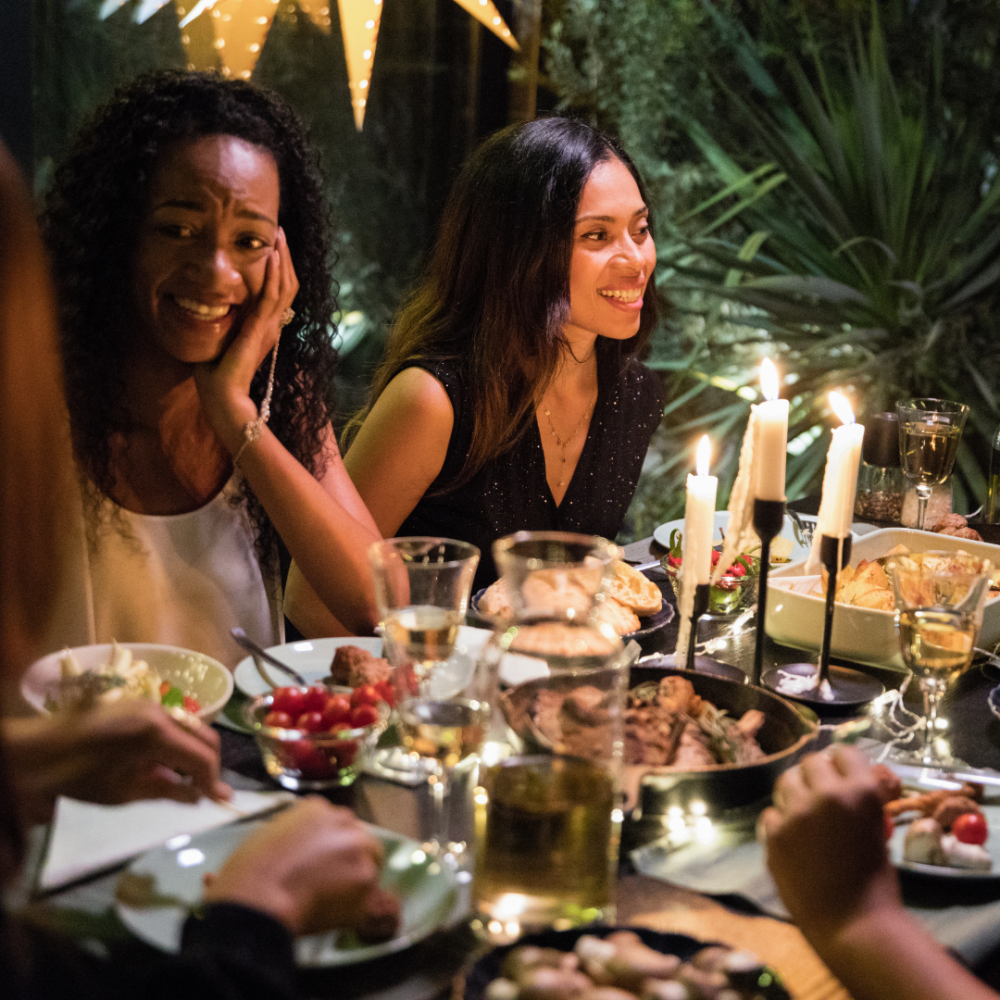 Middle aged woman smiling at a Holiday dinner