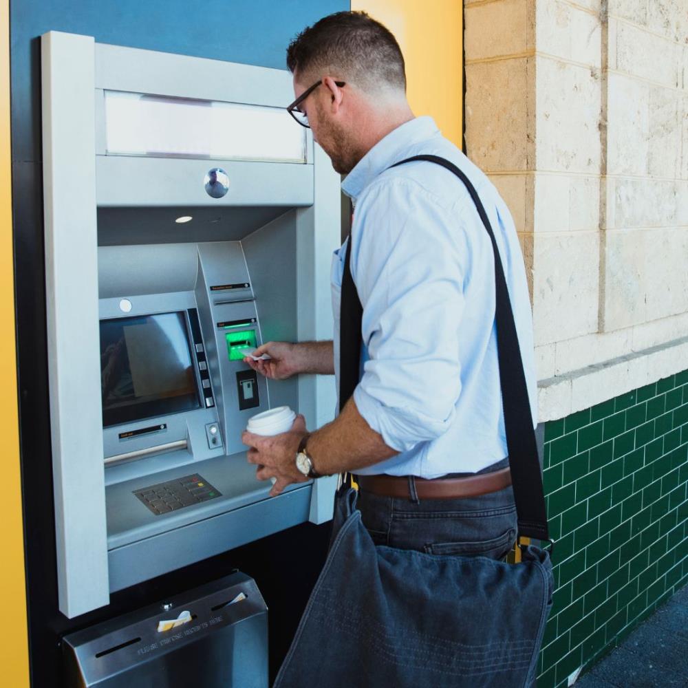 Man using ATM