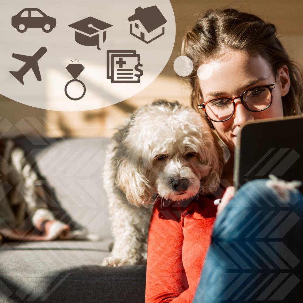 Woman and her white fluffy dog on laptop