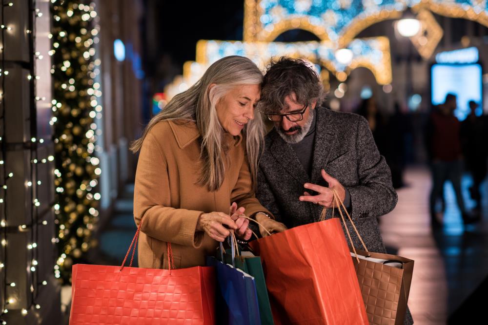 Older Couple Checking Holiday Purchases