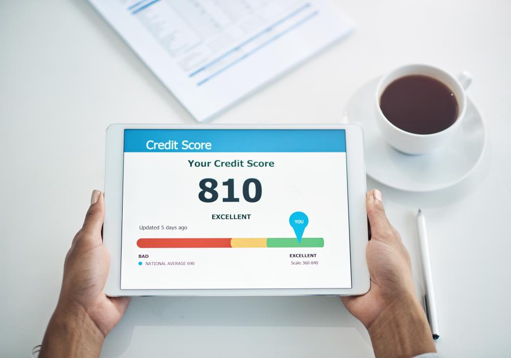 Female Holding a Tablet Displaying Improved Credit Score Information