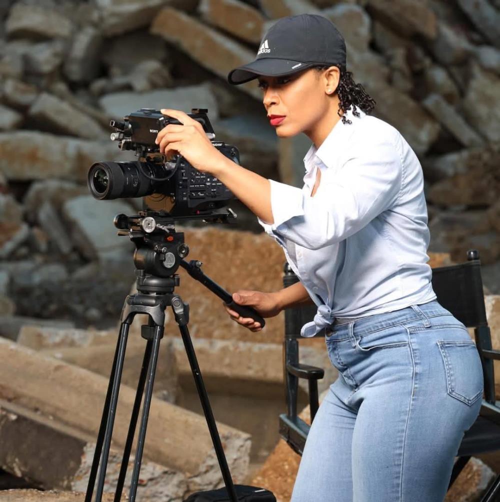 Prime Stone Media & Consulting owner Dreka Shevon standing behind a camera