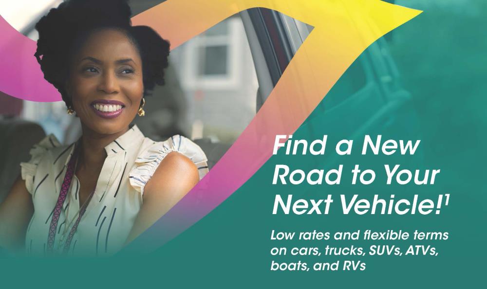 Smiling African-American Female Driving a New Car