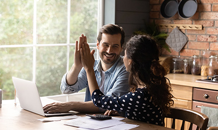 A couple high-fiving each other.