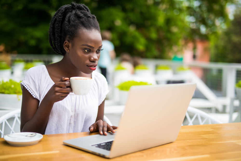 Woman looking at computer - links to Fraud Prevention page