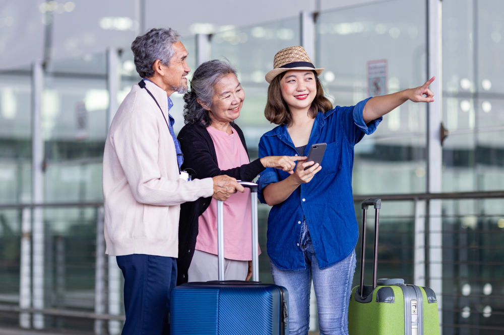 Older man and woman with young woman at airport