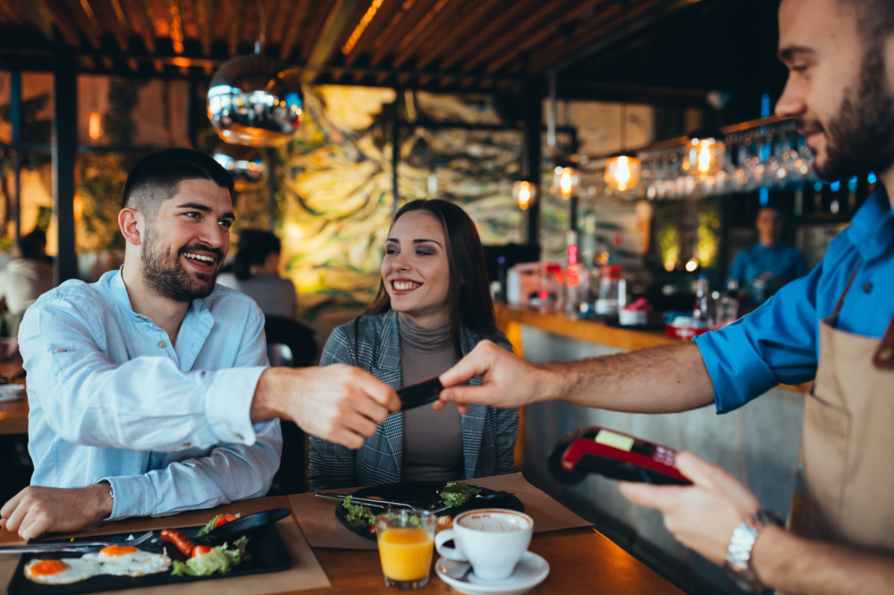 A man and a woman at a restaurant