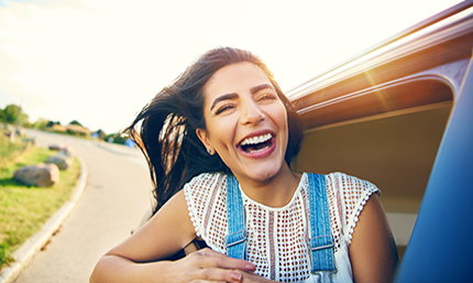 Young woman looking out of a car window